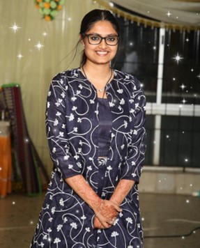 Person posing and smiling.