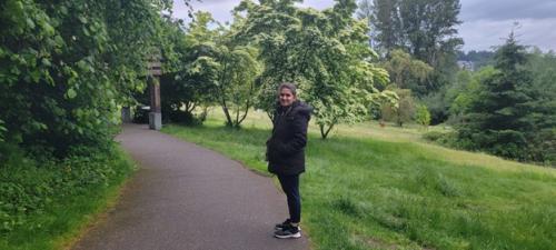 Person outside on walking path.