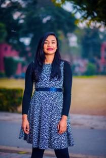 Picture of person outside smiling.