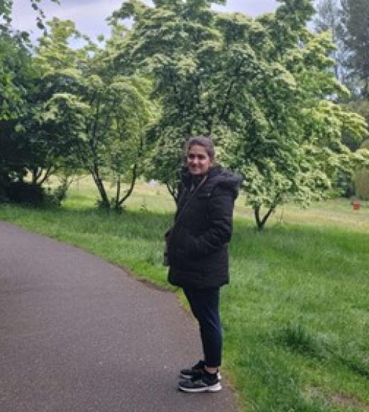 Person outside on walking path.